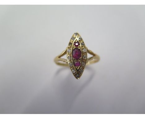 An 18ct yellow gold diamond and ruby type navette shaped ring size O - head approx 17mm x 7mm - approx weight 2.9 grams - in 