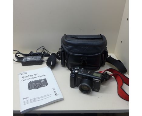 A Canon Power Shot G5 digital camera with Antler case in working order