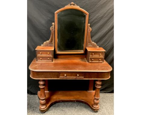 A Victorian mahogany dressing table, arched mirror back, drawered pillars, single frieze draw, turned baluster fore legs, she