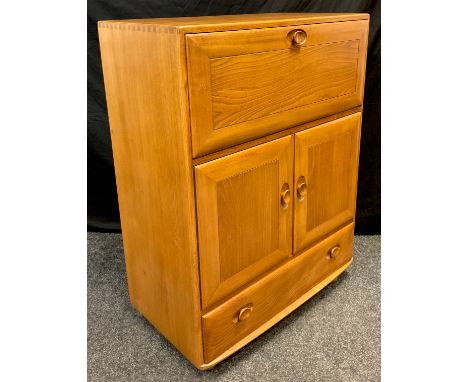 An Ercol ‘Windsor’ model 469 Elm bureau cabinet, 109cm high x 82.5cm wide x 44cm. 