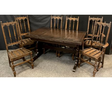 An Ercol dining table and set of six chairs - 434 model draw-leaf extending elm dining table, 74.5cm high x 83.5cm x 137cm (2