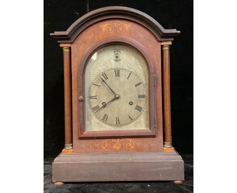 A bracket type mantel clock, arched silvered dial, Roman numerals, twin winding holes, 42.5cm high, early 20th century 