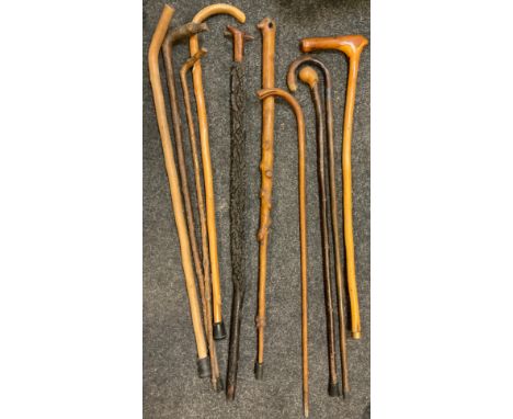An Elder textured walking stick;  others, Hawthorn etc, one with silver ferule, marks worn (10) 