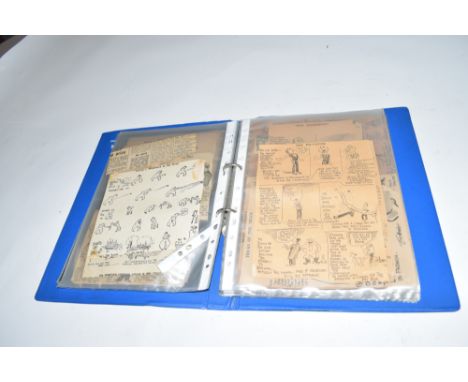 Blue ring binder containing a large collection of Tom Webster's cartoons for The Daily Mail, many clipped from newspapers plu
