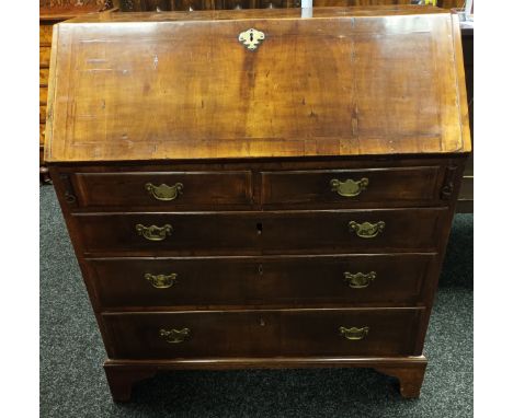 Burr walnut bureau, rectangular top above a drop down writing surface with interior storage, above chest of two short drawers