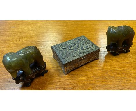 A Japanese dragon design trinket box together with two hand carved hardstone/ jade elephant sculptures on hand carved stands.