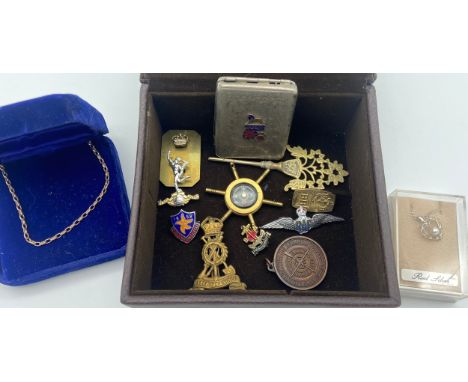 A Selection of military items and silver jewellery to include pendant compass, RAF Wing badge and matchstick holder. 