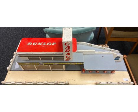 A Vintage Dunlop advertising garage for toy cars 