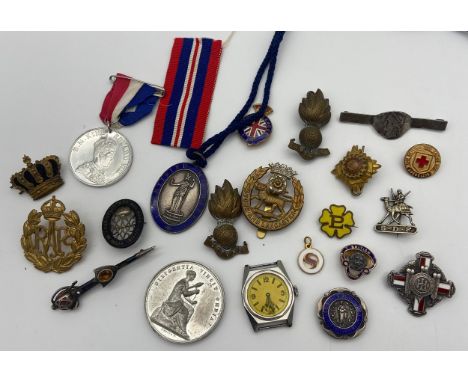 A Selection of Military and Nurse/ midwifery services badges, medals and coins etc to include enamel and silver cross brooch 