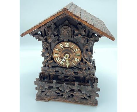 Black Forest cuckoo clock, 19th Century, [Johann Baptist Beha], ornate design with foliate decoration, [36.5x25x18.5cm] 