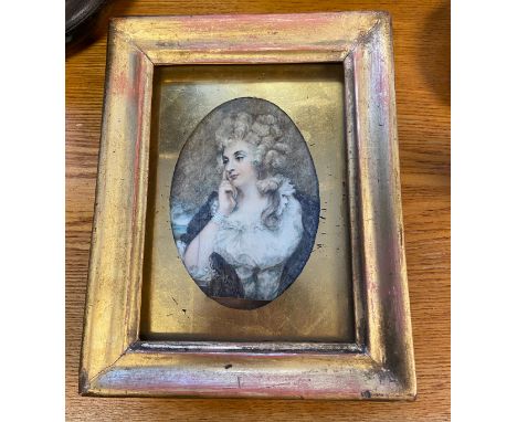 An 19th century hand painted miniature portrait. Fitted within a gilt frame. [Frame 17x13.5cm] 