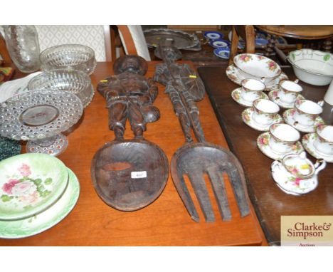 A large carved spoon and fork