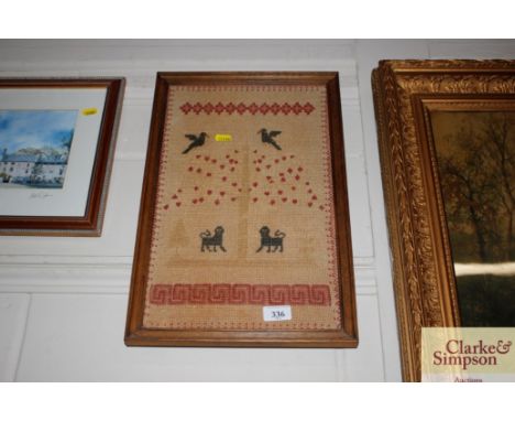 A wool work sampler depicting dogs and birds