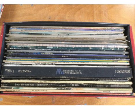 A record case of folk rock LPs by various artists including Neil Young, Bob Dylan, Jackson Browne and others.