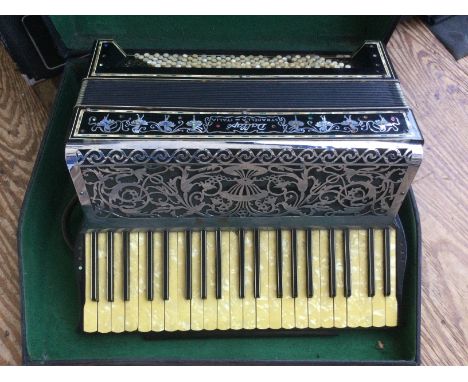A cased Dallape accordion.