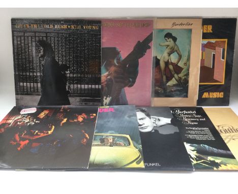 Two bags containing seventeen folk rock LPs by various artists including Bob Dylan, Neil Young, Ry Cooder and others.