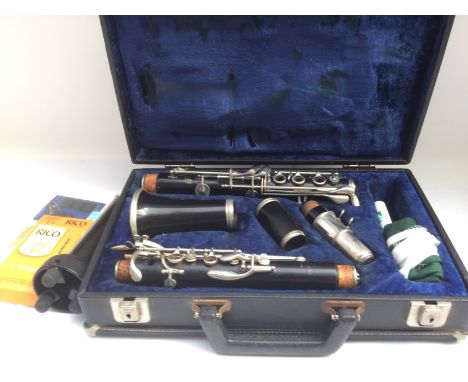 A cased 1960s Boosey & Hawkes clarinet with stand and accessories.