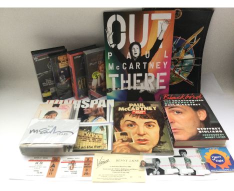 A collection of Paul McCartney & Wings ephemera comprising tickets, programs, books, t shirt, videos etc. Includes a Denny La