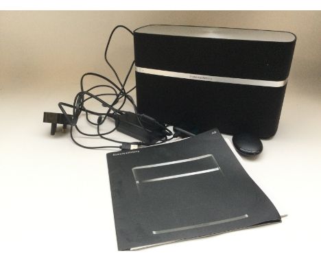 A Bowers & Wilkins A5 bluetooth wireless speaker system. Comes with manual and accessories.