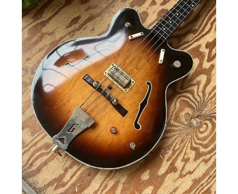 A 1963 Gretsch Country Gentleman bass guitar in two tone sunburst. All original but with missing mute and one missing strap b