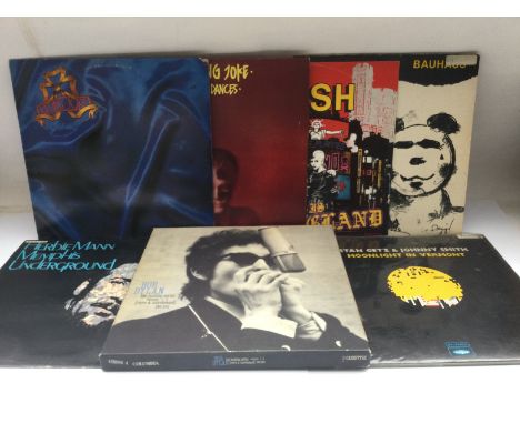 A record case and a box of LPs, 12inch and 7inch singles by various artists including Killing Joke, Bauhaus, Herbie Mann, Oti