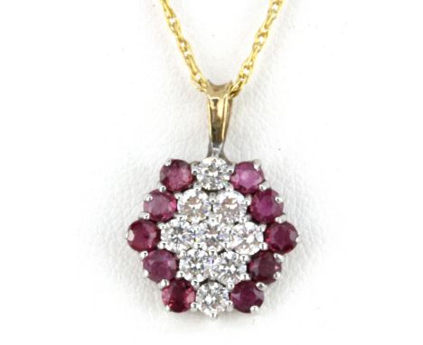 A 9ct yellow gold ruby and white stone set pendant and chain, L. 2cm.