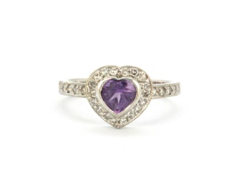 A 9ct white gold ring set with heart cut amethyst and diamonds, (P).