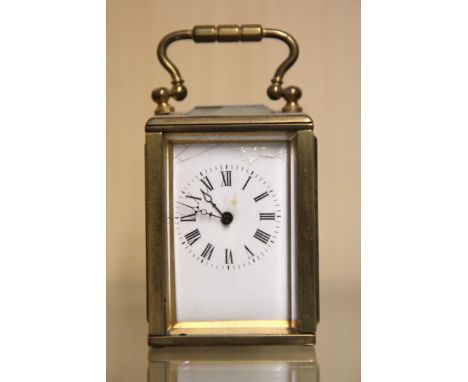 A miniature brass carriage clock, H. 9cm. Condition: dial enamel damaged, working condition unknown.