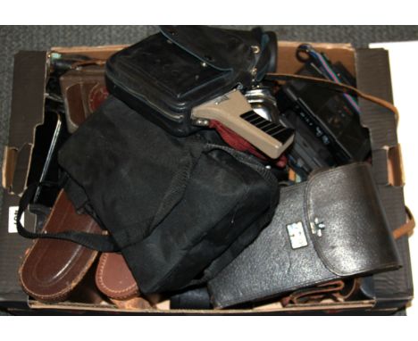 A box of vintage cameras and binoculars.
