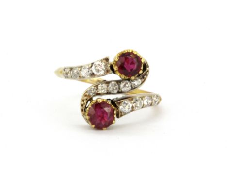 An 18ct yellow gold (stamped 18ct) ring set with rubies and old cut diamonds, (K).