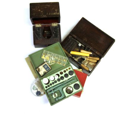 A quantity of watch makers tools, wrist watch glasses, etc.