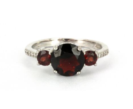 A 925 silver garnet set ring, (O.5).