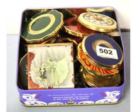 A quantity of vintage powder compacts.