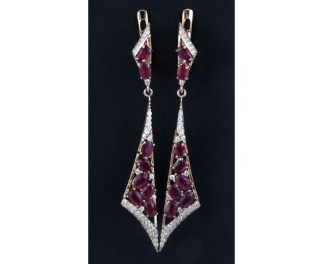 A pair of 925 silver rose gold gilt drop earrings set with oval cut rubies and white stones, L. 6cm.