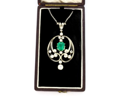 A yellow and white metal (tested gold and silver) pendant set with an emerald cut emerald and old brilliant cut diamonds, L. 