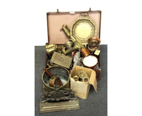A vintage case of brass and other items.