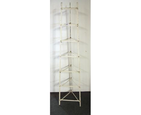 A vintage metal plate stand, H. 142cm.