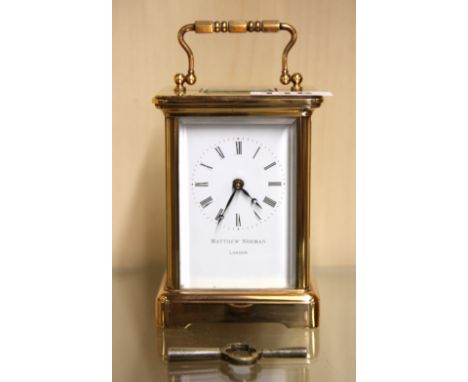 A Matthew Norman gilt brass carriage clock, H. 14.5cm. Condition: understood to be in working order.