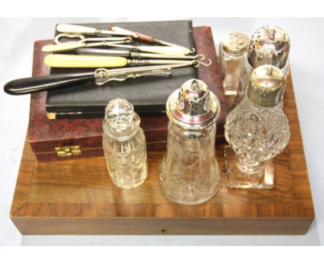 A quantity of vintage cutlery, sugar shakers, etc.