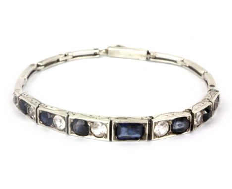 A 1920's white metal (tested silver) sapphire and white topaz set bracelet.