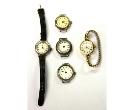 Three lady's vintage silver wrist watches and two others.