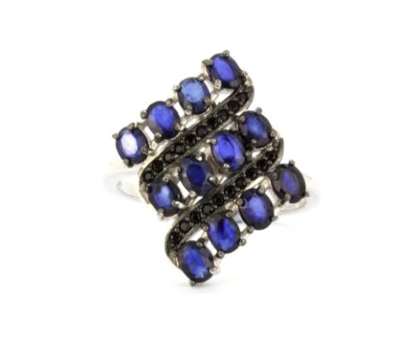 A 925 silver ring set with oval cut kyanite and black spinel, (Q).