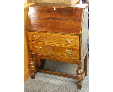 A vintage oak bureau, W. 66cm.