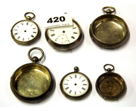 A group of silver pocket watches and watch cases.