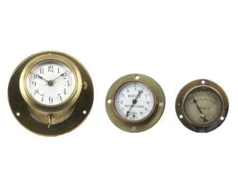 Three brass-cased dashboard instruments,comprising a car clock by the New Haven Clock Co. Connecticut, USA, patented March 28