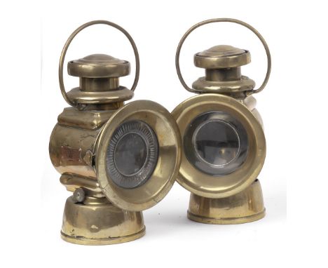 A pair of Lucas No.652 oil-illuminating side-lamps,brass bodies, 3¾ inch lenses inset with bulls-eye lens and one with starbu