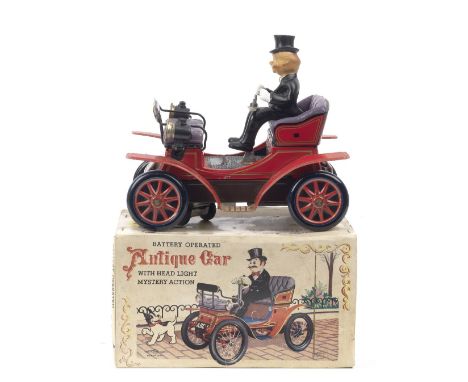 A boxed 'Antique Car' battery-operated tin-plate toy by Toys Nomura (T.N) of Japan,1960s, lithographed tin-plate toy depictin