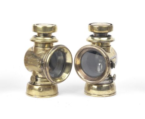 A pair of Lucas No.F.146 oil-illuminating side-lamps,polished brass bodies, 3 inch clear lenses with ruby red tell-tale rear 