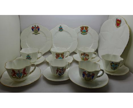 Shelley crested ware; one large plate, three small plates, a saucer, seven cups and six plain saucers 