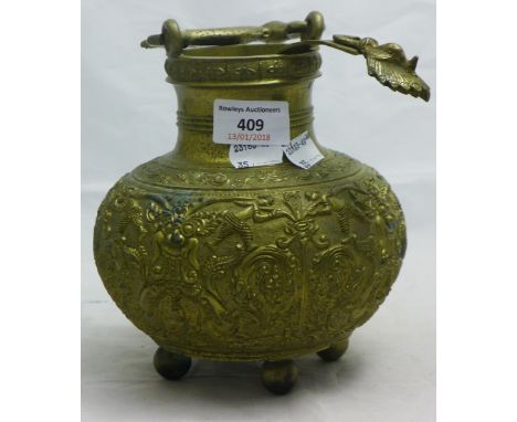 A Tibetan brass vessel and ladle